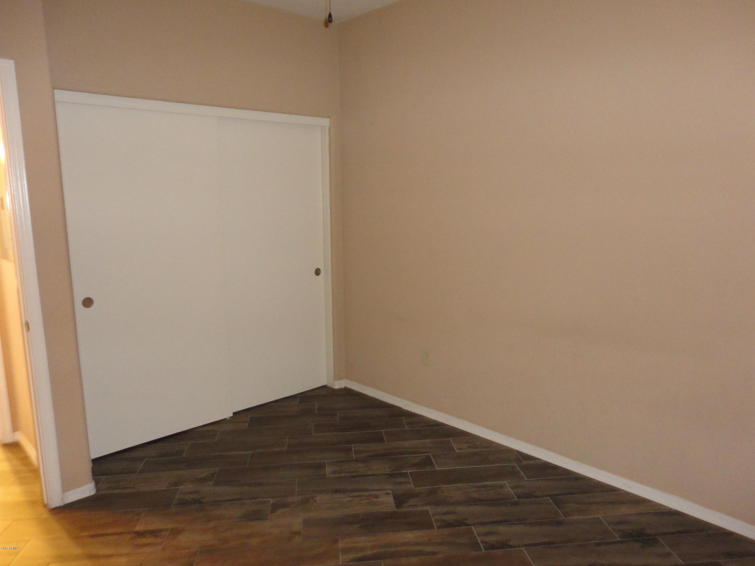 3434 East Baseline Road, Unit 166 Phoenix, AZ 85042 - Photo 5 of 13 a view of small space with wooden floor