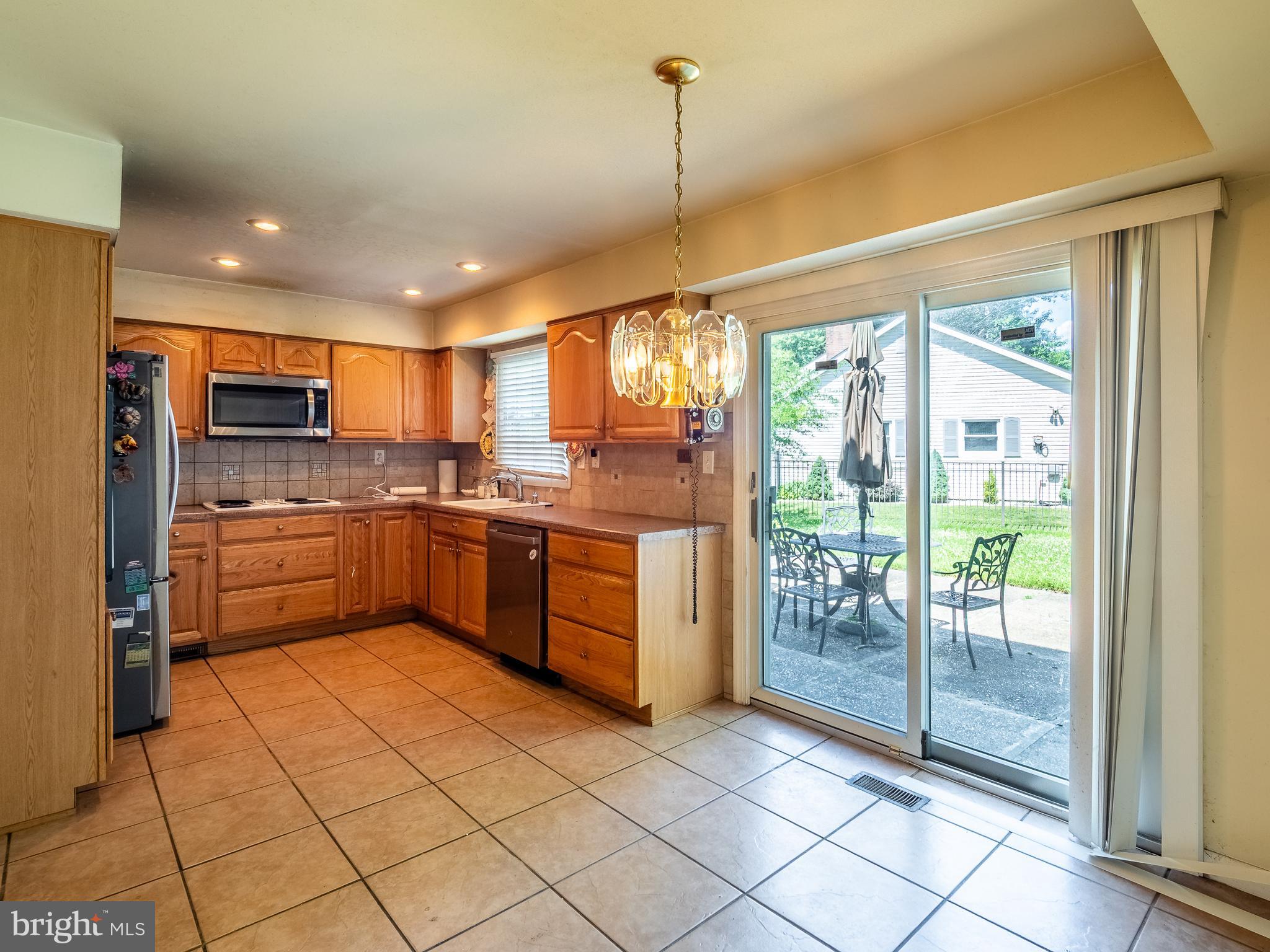 33 Timber Lane Willingboro, NJ 08046 - Photo 14 of 31 a kitchen with stainless steel appliances granite countertop a stove a sink and a refrigerator