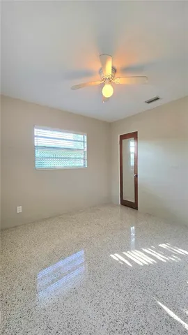 a view of an empty room with a window