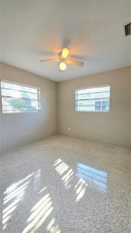 a view of a field with an trees