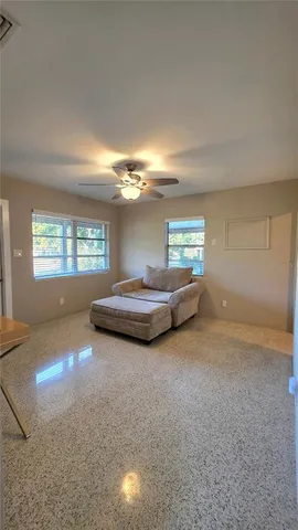 a bedroom with furniture and a window
