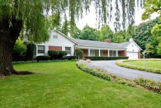 340 Moraine Road Highland Park, IL 60035 - Photo 1 of 10 a front view of house with a garden and yard