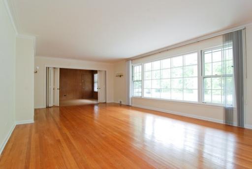 340 Moraine Road Highland Park, IL 60035 - Photo 2 of 10 a view of an empty room with wooden floor and a window