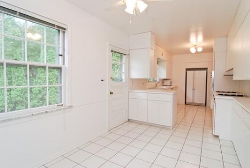340 Moraine Road Highland Park, IL 60035 - Photo 3 of 10 a kitchen with a sink cabinets and window