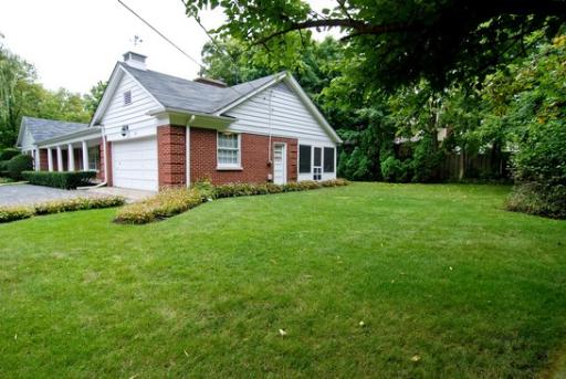 340 Moraine Road Highland Park, IL 60035 - Photo 10 of 10 a view of a house with a big yard potted plants and large tree