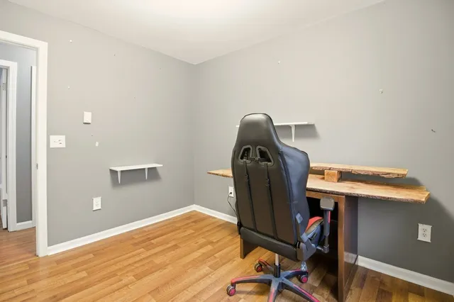 a view of workspace with wooden floor