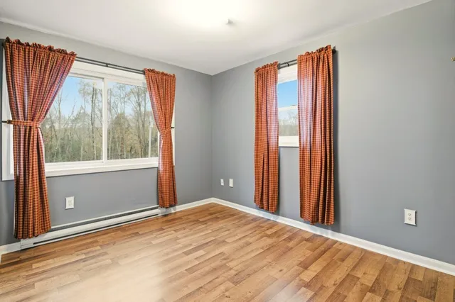 a view of a room with window and doors