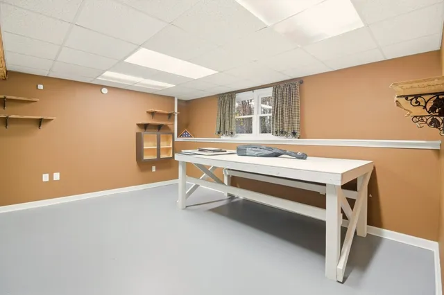 a view of kitchen with stainless steel appliances cabinets and wooden floor