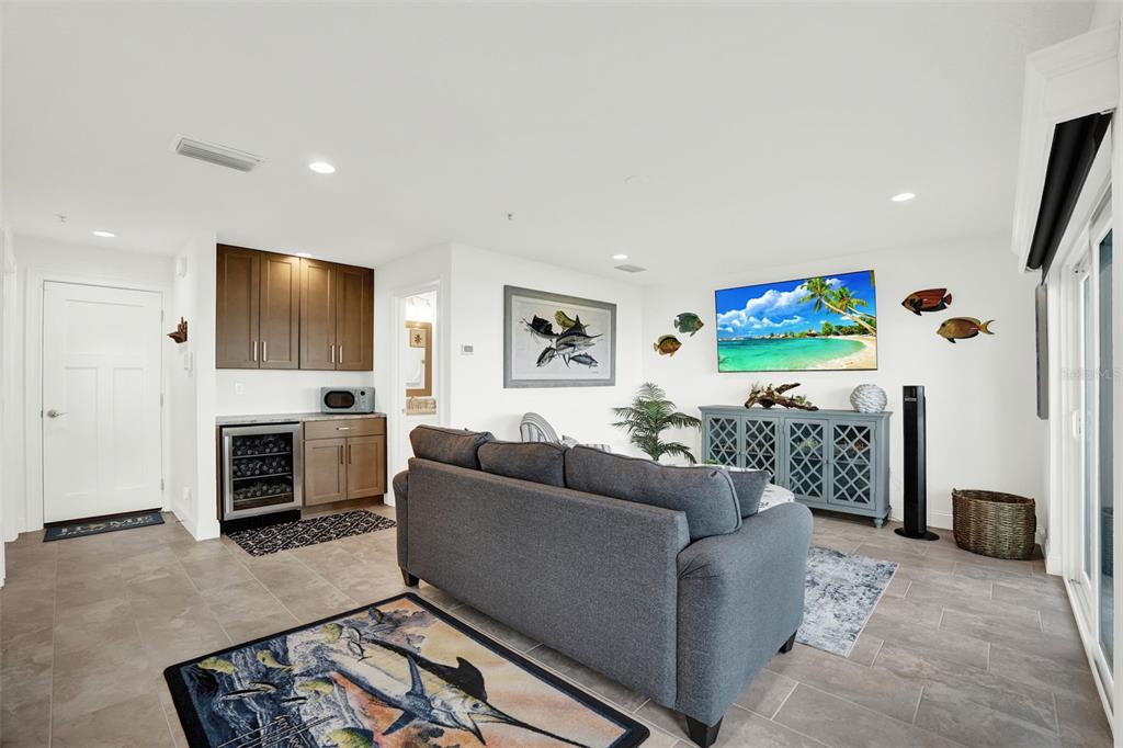 7 Marden Drive Ormond Beach, FL 32176 - Photo 11 of 68 a living room with furniture a fireplace and a flat screen tv