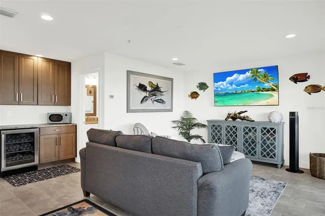 a bathroom with a granite countertop toilet and a sink