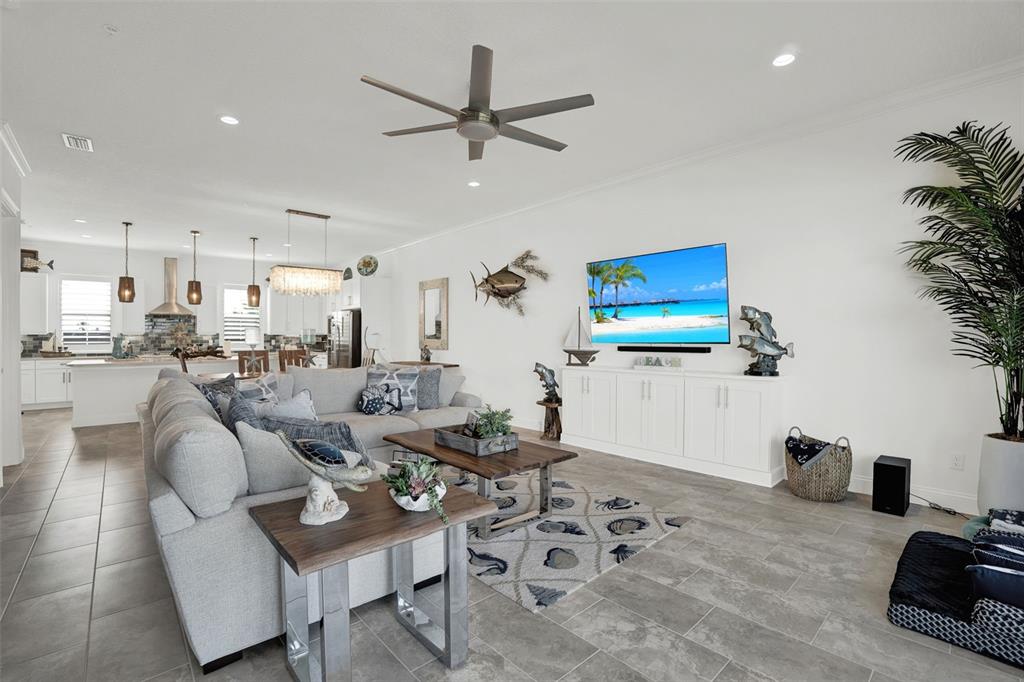 7 Marden Drive Ormond Beach, FL 32176 - Photo 17 of 68 a living room with furniture kitchen view and a potted plant