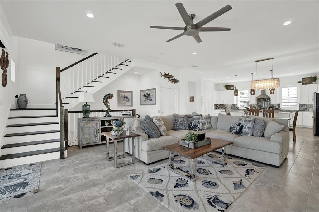 7 Marden Drive Ormond Beach, FL 32176 - Photo 18 of 68 a living room with furniture kitchen view and a chandelier