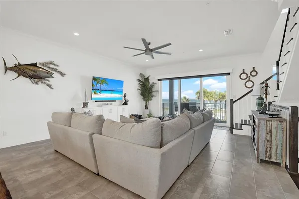 a dining table with chairs and kitchen view