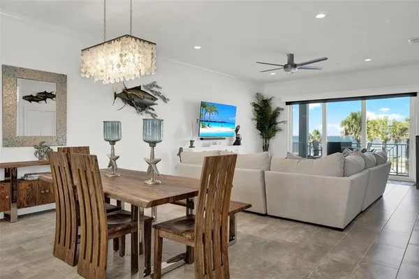 a kitchen with stainless steel appliances kitchen island granite countertop a sink a stove and a wooden floors