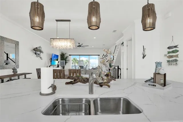 a bedroom with a large bed and a large window