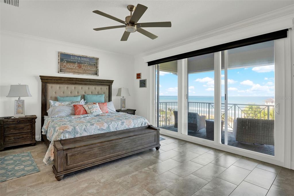 7 Marden Drive Ormond Beach, FL 32176 - Photo 37 of 68 a bedroom with a large bed and a large window