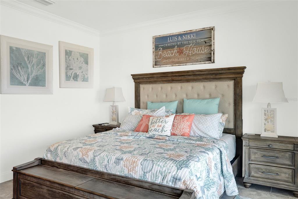 7 Marden Drive Ormond Beach, FL 32176 - Photo 39 of 68 a bedroom with a bed and painting on the wall