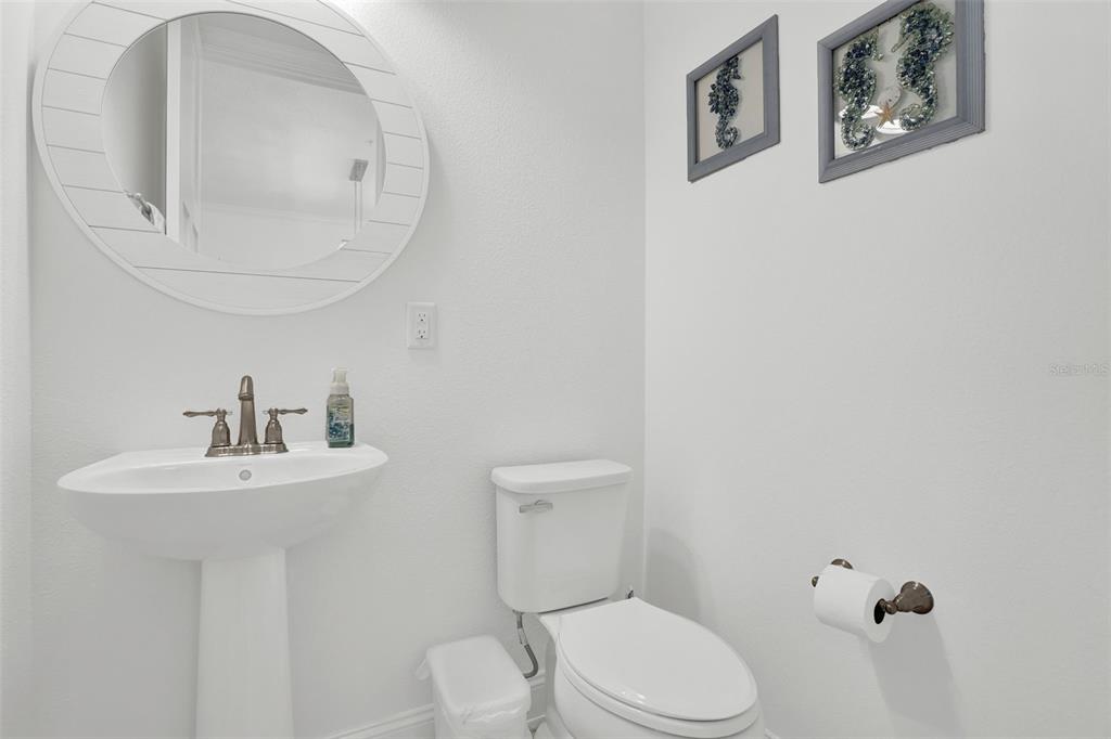 7 Marden Drive Ormond Beach, FL 32176 - Photo 45 of 68 a bathroom with a toilet sink and mirror