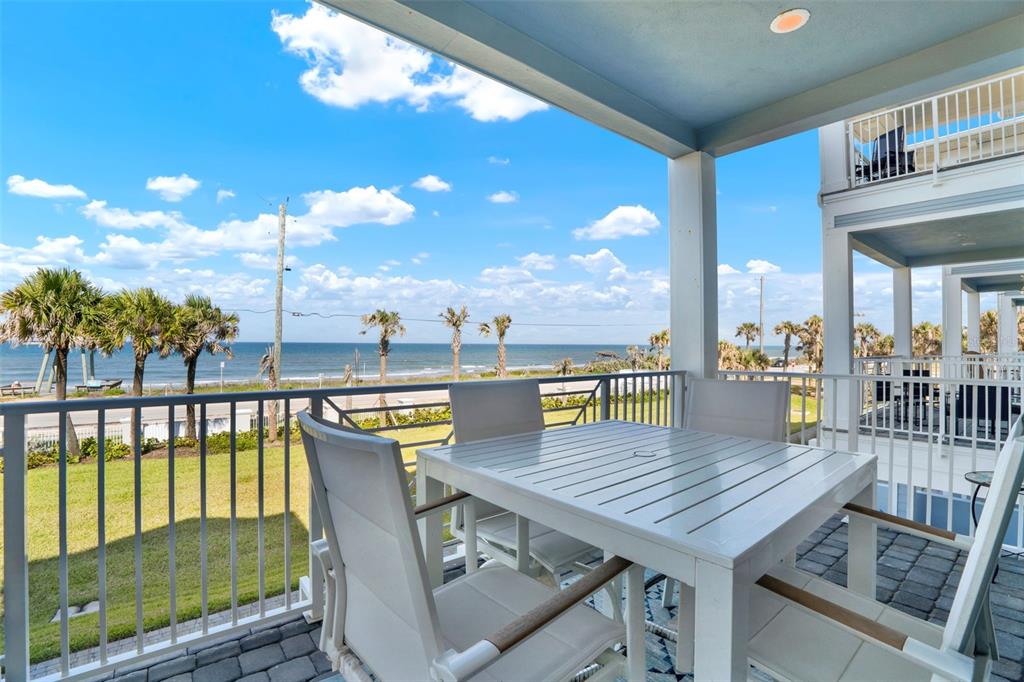 7 Marden Drive Ormond Beach, FL 32176 - Photo 50 of 68 a view of a balcony dining table and chairs