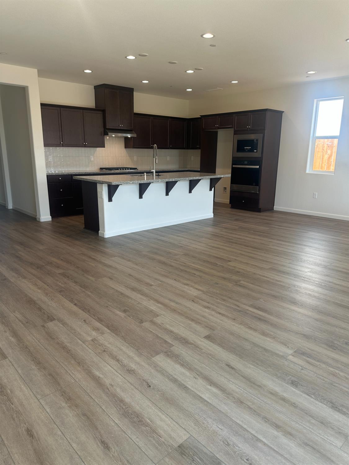 1237 Cathedral Court South Madera, CA 93636 - Photo 3 of 8 a view of kitchen with stainless steel appliances granite countertop a refrigerator and a sink