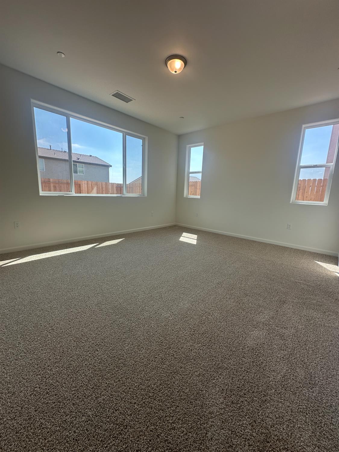 1237 Cathedral Court South Madera, CA 93636 - Photo 8 of 8 a view of an empty room with a window