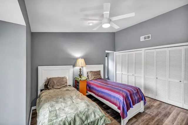 a bedroom with a bed and a lamp