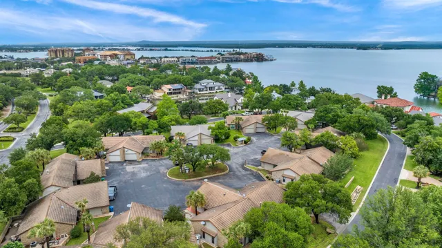an aerial view of a house with a lake view
