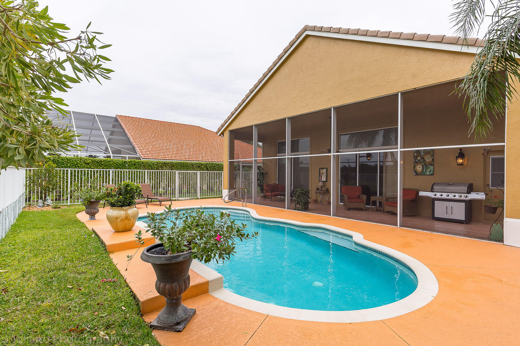 10880 Tea Olive Lane Boca Raton, FL 33498 - Photo 27 of 56 a view of outdoor space yard swimming pool and patio