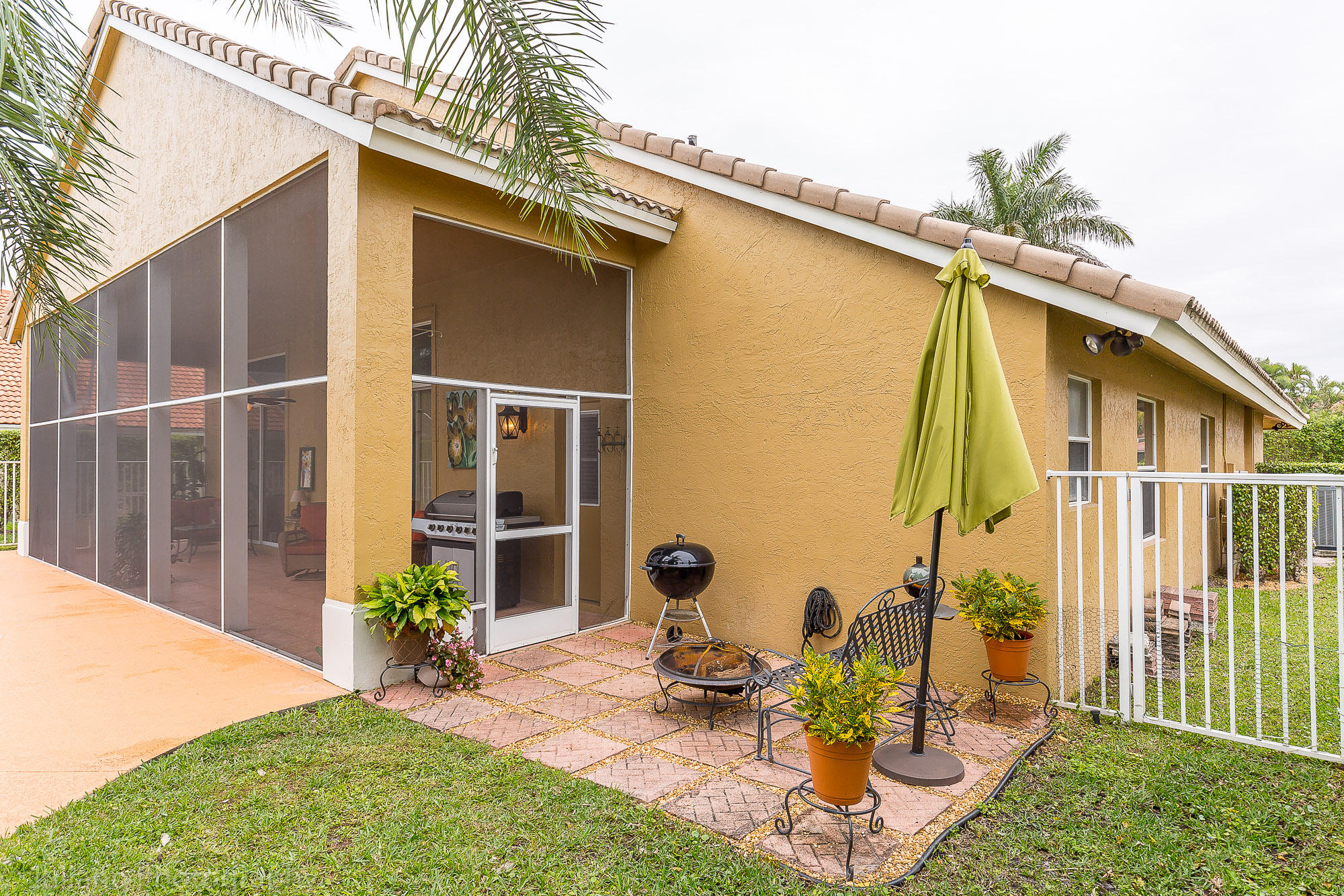 10880 Tea Olive Lane Boca Raton, FL 33498 - Photo 29 of 56 a front view of a house with garden