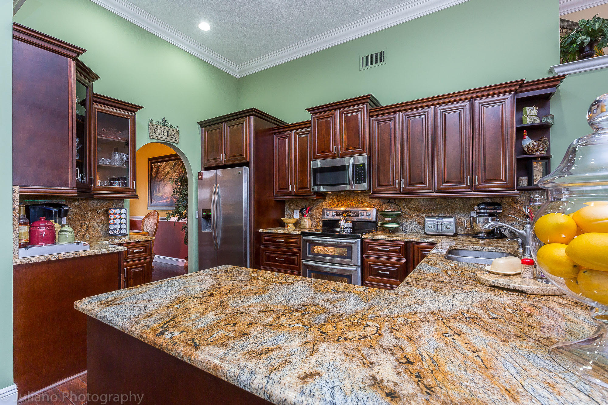 10880 Tea Olive Lane Boca Raton, FL 33498 - Photo 3 of 56 a kitchen with stainless steel appliances granite countertop a refrigerator stove top oven and sink
