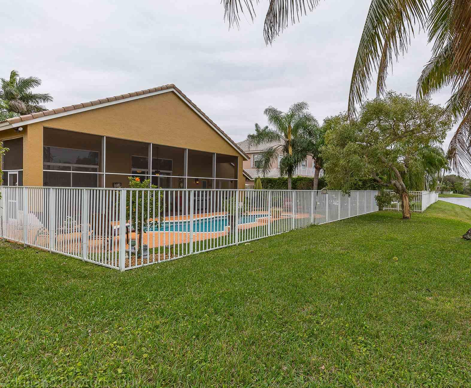 10880 Tea Olive Lane Boca Raton, FL 33498 - Photo 31 of 56 a view of a backyard with a garden