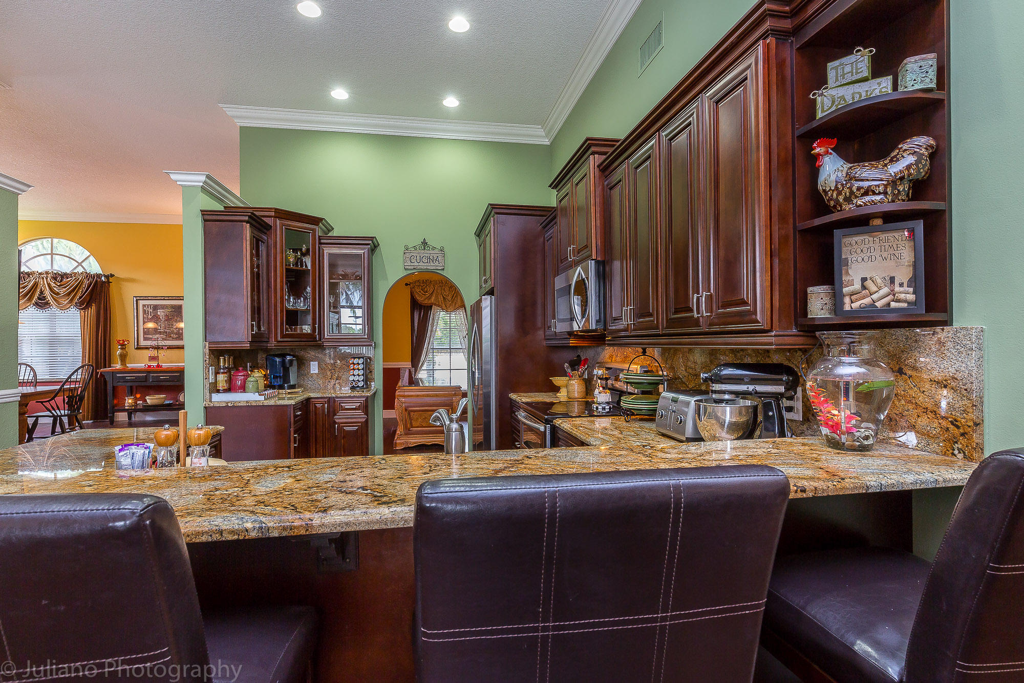 10880 Tea Olive Lane Boca Raton, FL 33498 - Photo 6 of 56 a kitchen with stainless steel appliances granite countertop a sink and cabinets