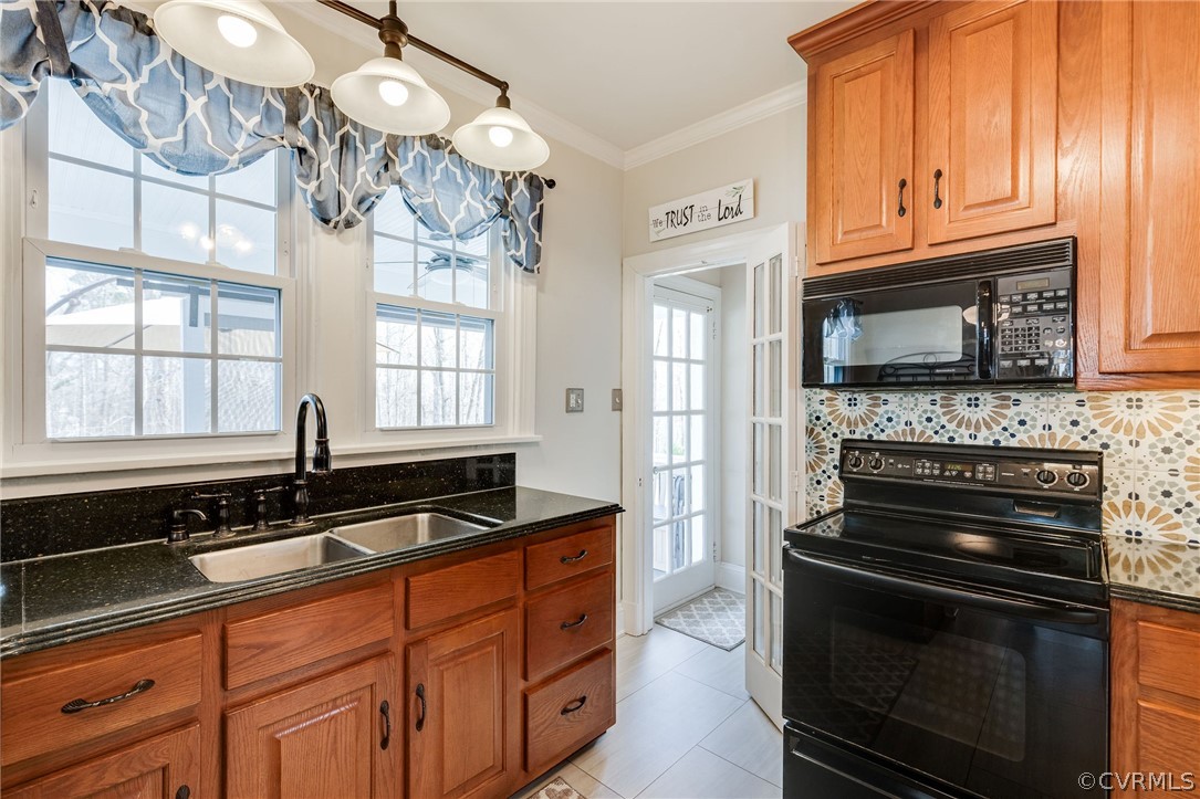 501 Old Hundred Road Midlothian, VA 23113 - Photo 22 of 44 a kitchen with granite countertop a stove and a sink