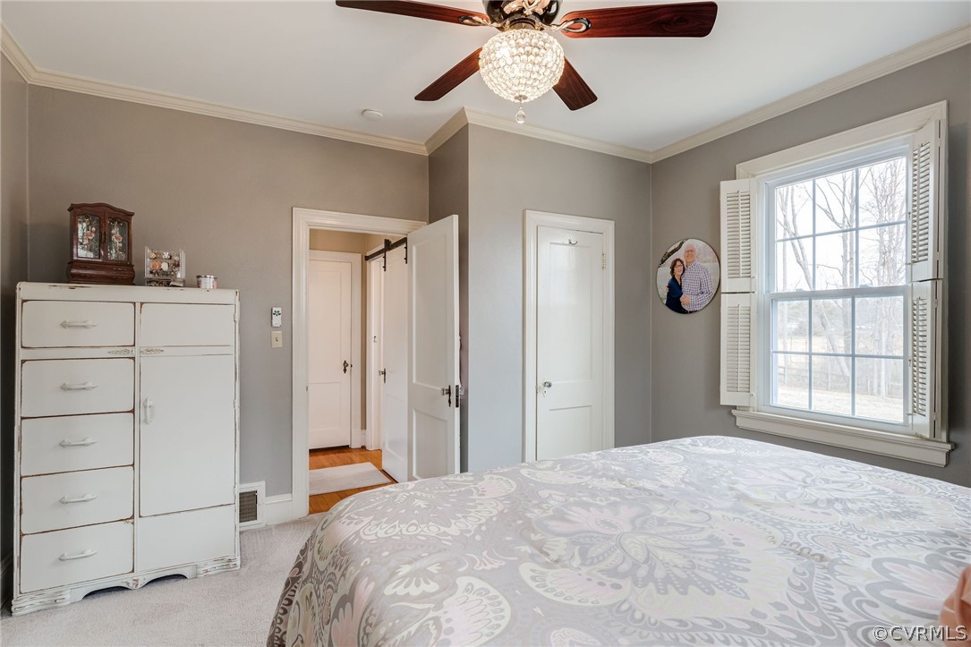501 Old Hundred Road Midlothian, VA 23113 - Photo 27 of 44 a bedroom with a bed and a window