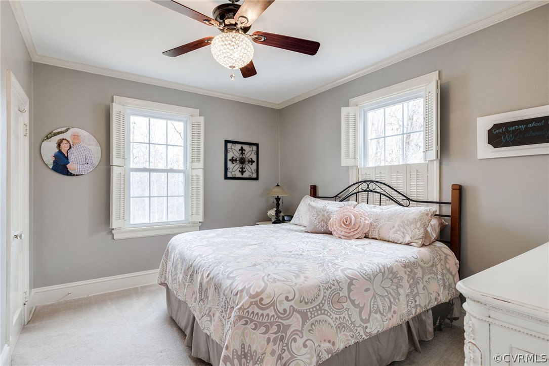 501 Old Hundred Road Midlothian, VA 23113 - Photo 4 of 44 a bedroom with a large bed and a window