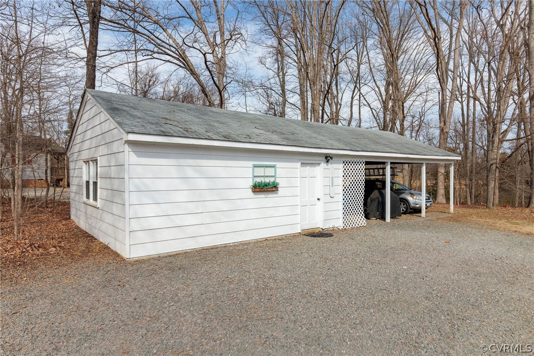 501 Old Hundred Road Midlothian, VA 23113 - Photo 9 of 44 a view of a house with a yard and garage