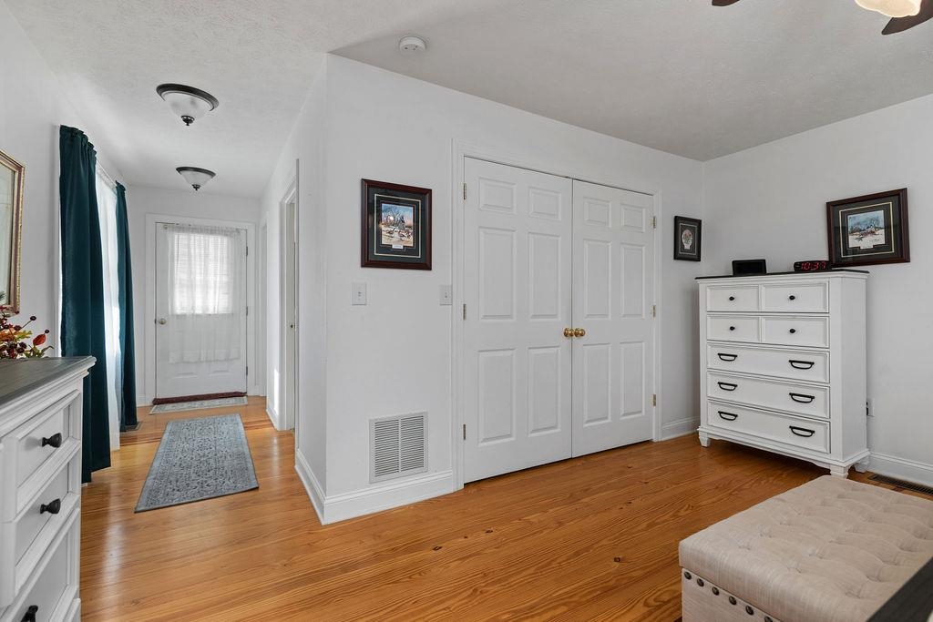 115 Old Hermitage Road Waynesboro, VA 22980 - Photo 21 of 63 a view of a bedroom with wooden floor and cabinet