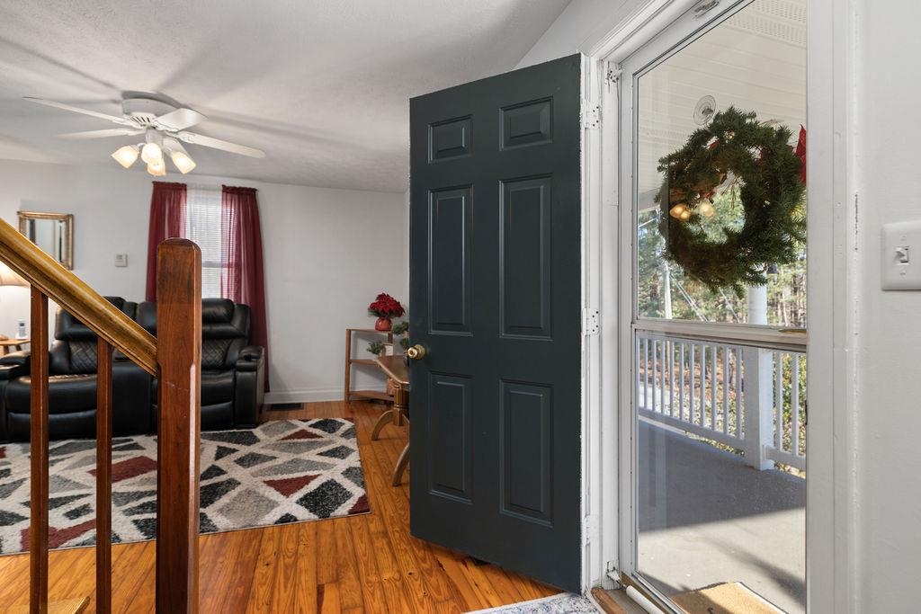 115 Old Hermitage Road Waynesboro, VA 22980 - Photo 3 of 63 a view of a hallway with wooden floor and staircase