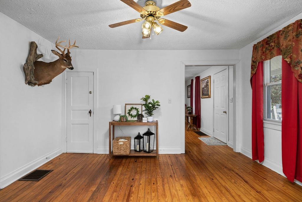 115 Old Hermitage Road Waynesboro, VA 22980 - Photo 8 of 63 a view of a workspace with wooden floor and chandelier fan