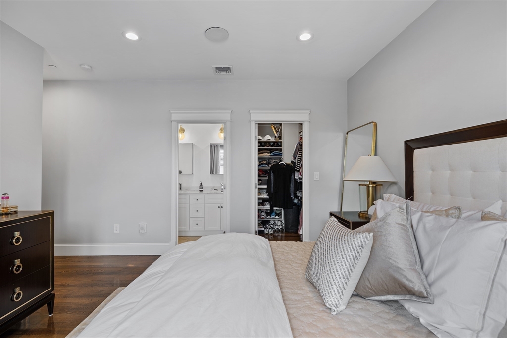 57 L Street, Unit 6 Boston, MA 02127 - Photo 13 of 21 a bedroom with a bed and a night stand