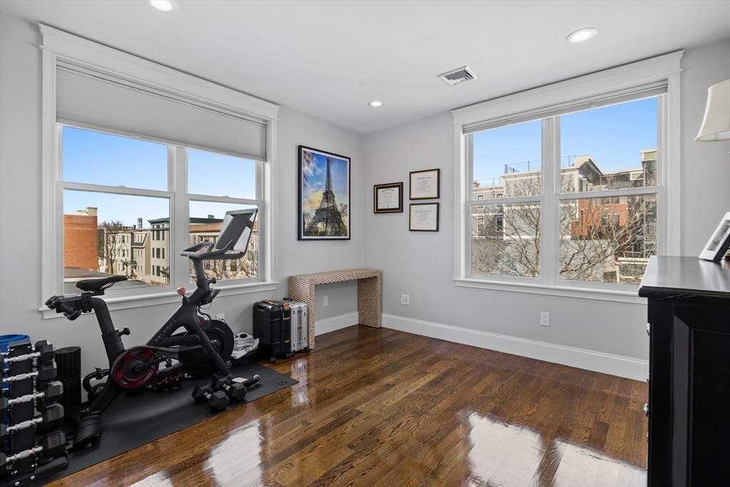 57 L Street, Unit 6 Boston, MA 02127 - Photo 16 of 21 a room with gym equipment and a large window