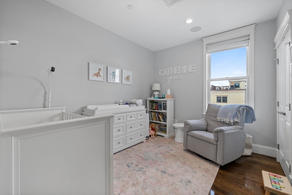 57 L Street, Unit 6 Boston, MA 02127 - Photo 19 of 21 a living room with furniture and a window
