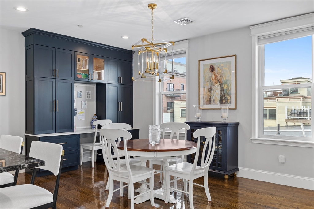 57 L Street, Unit 6 Boston, MA 02127 - Photo 5 of 21 a view of a dining room with furniture window and wooden floor