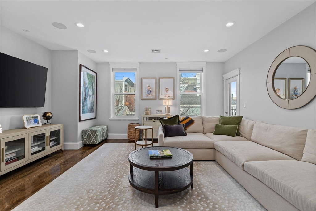 57 L Street, Unit 6 Boston, MA 02127 - Photo 7 of 21 a living room with furniture and a flat screen tv
