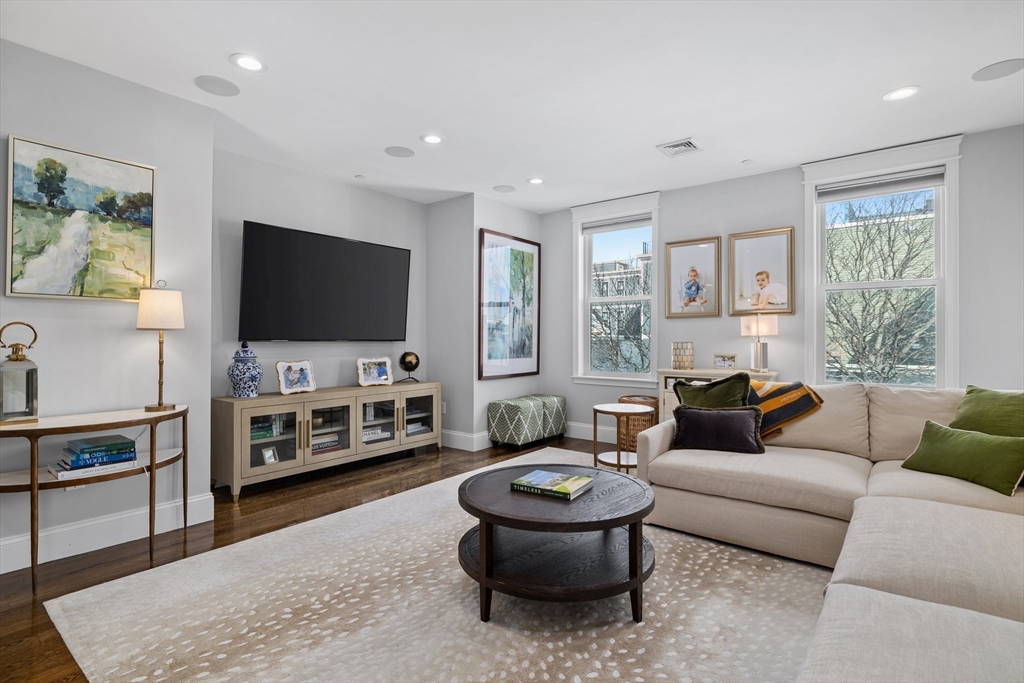 57 L Street, Unit 6 Boston, MA 02127 - Photo 9 of 21 a living room with furniture and a flat screen tv