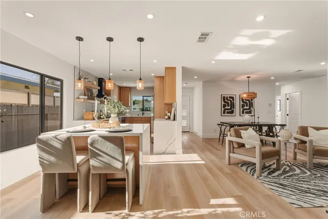 a bathroom with a sink mirror and a shower