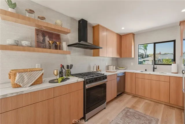a kitchen with a sink cabinets and window