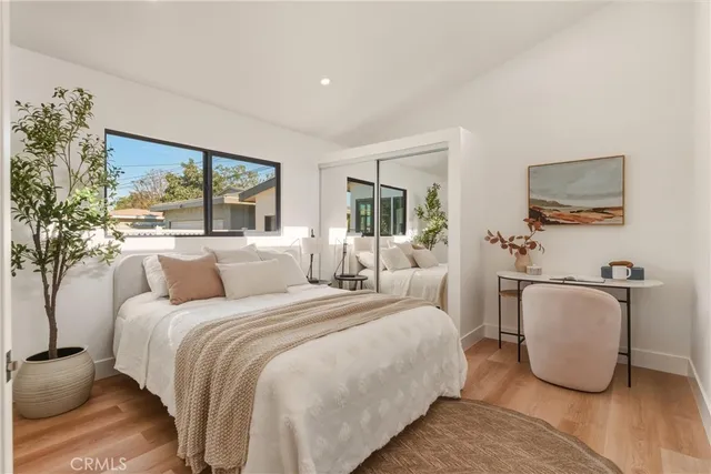 a bedroom with a bed and a couch