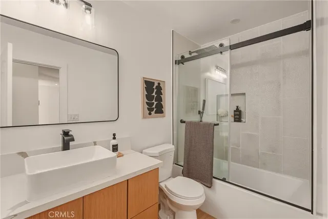 a view of a room with wooden floor and window