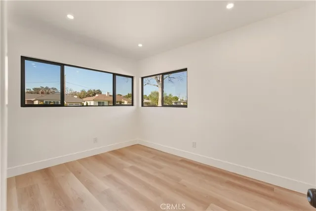 a spacious bedroom with a large bed and a couch